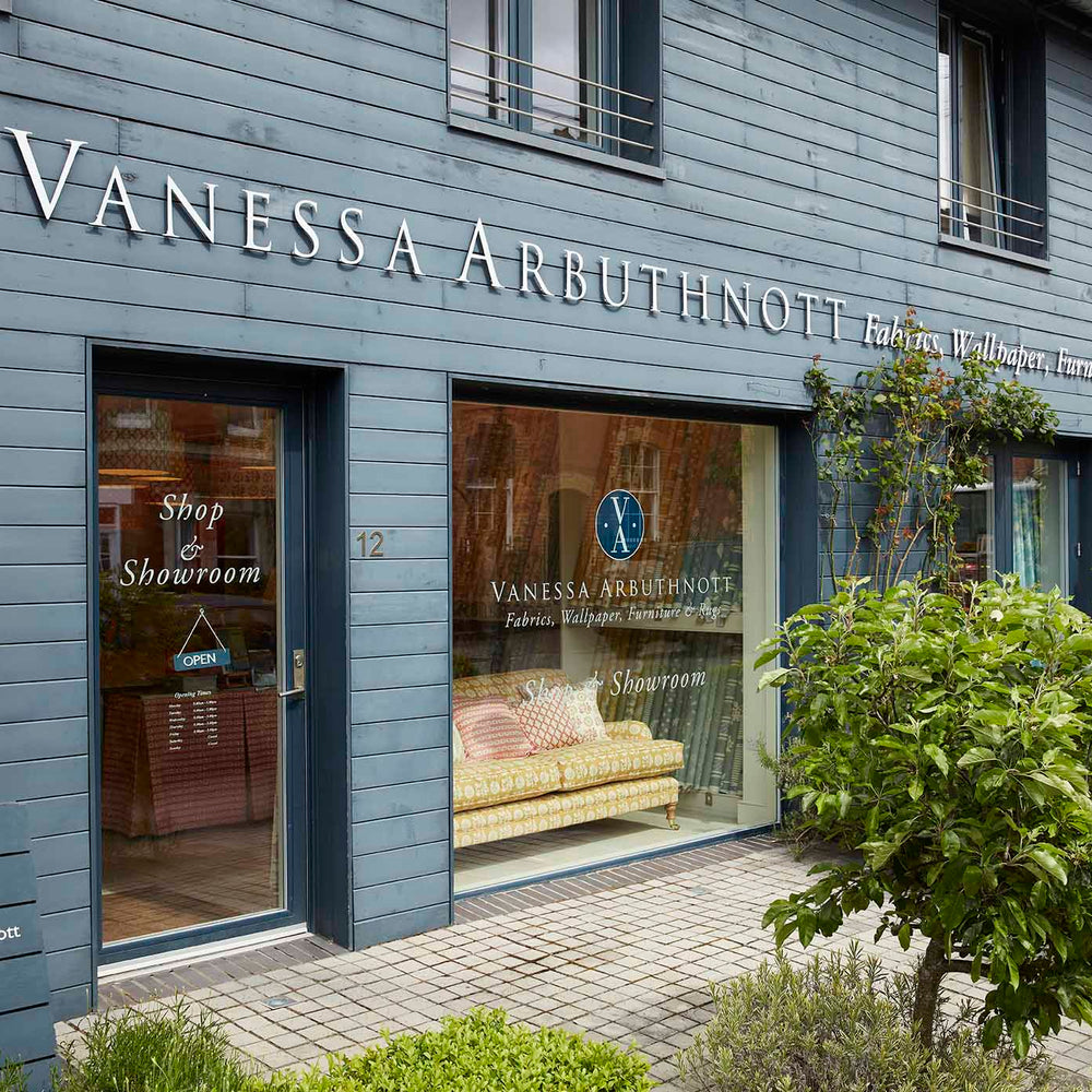 Vanessa Arbuthnott furniture store with glass windows displaying interior decor.
